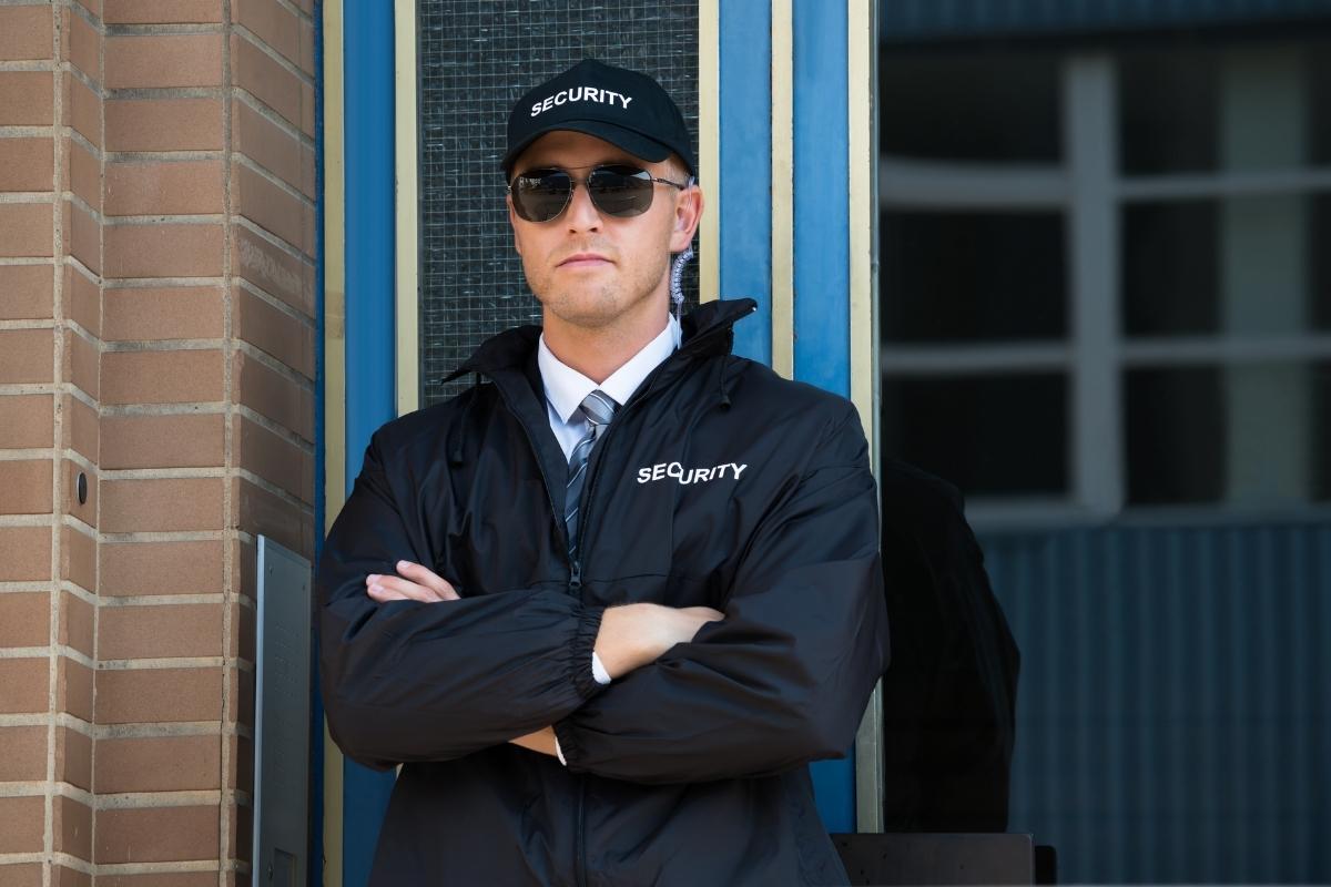 Building security guard watching over premises