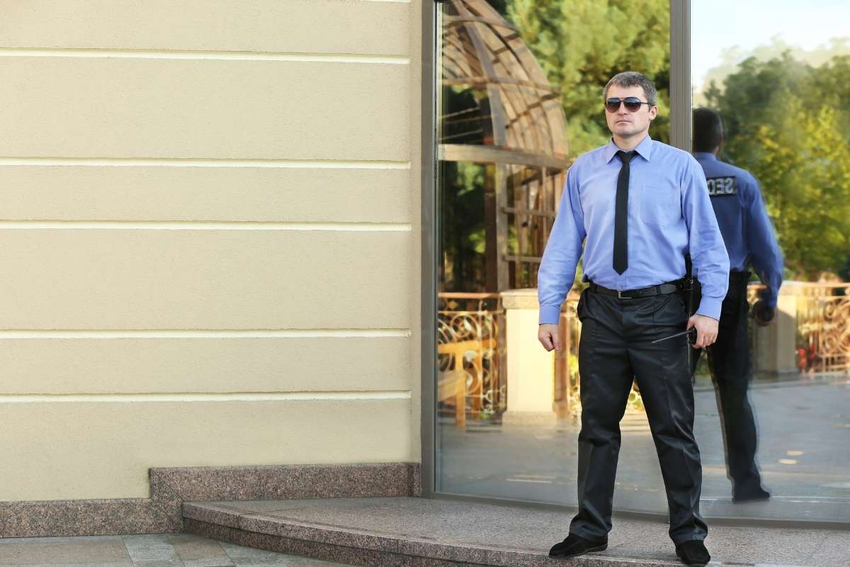 Security guard monitoring shopping center entrance