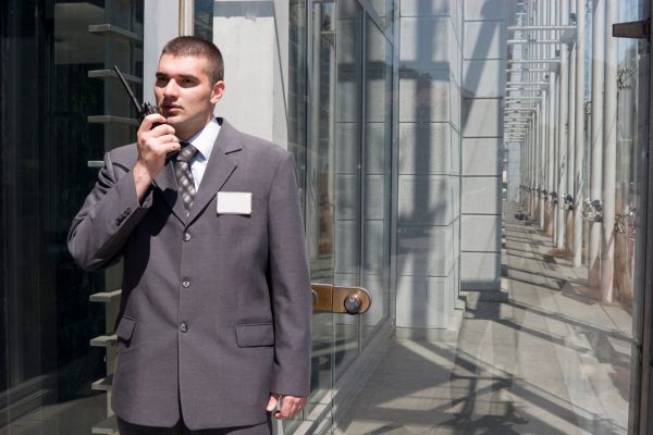 Building security guard patrolling the building.
