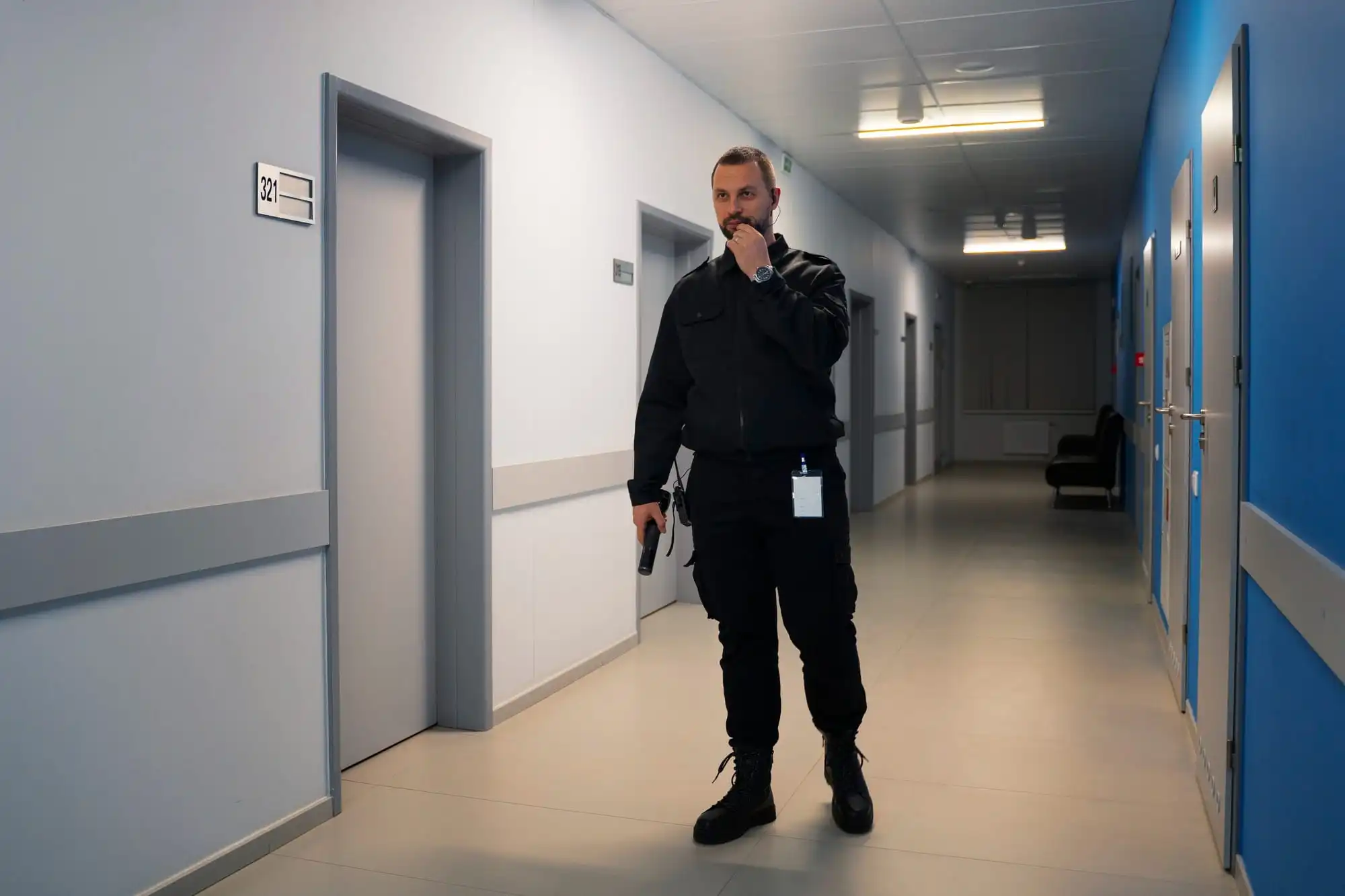 security guard patrolling the building at night