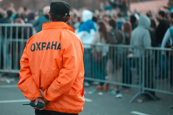 Event security guard watching the crowd.