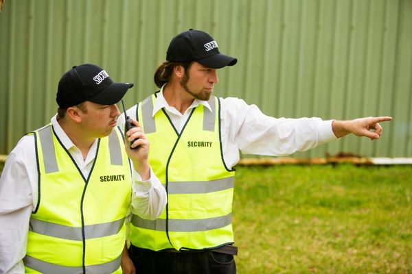Security guards wearing reflective safety vests