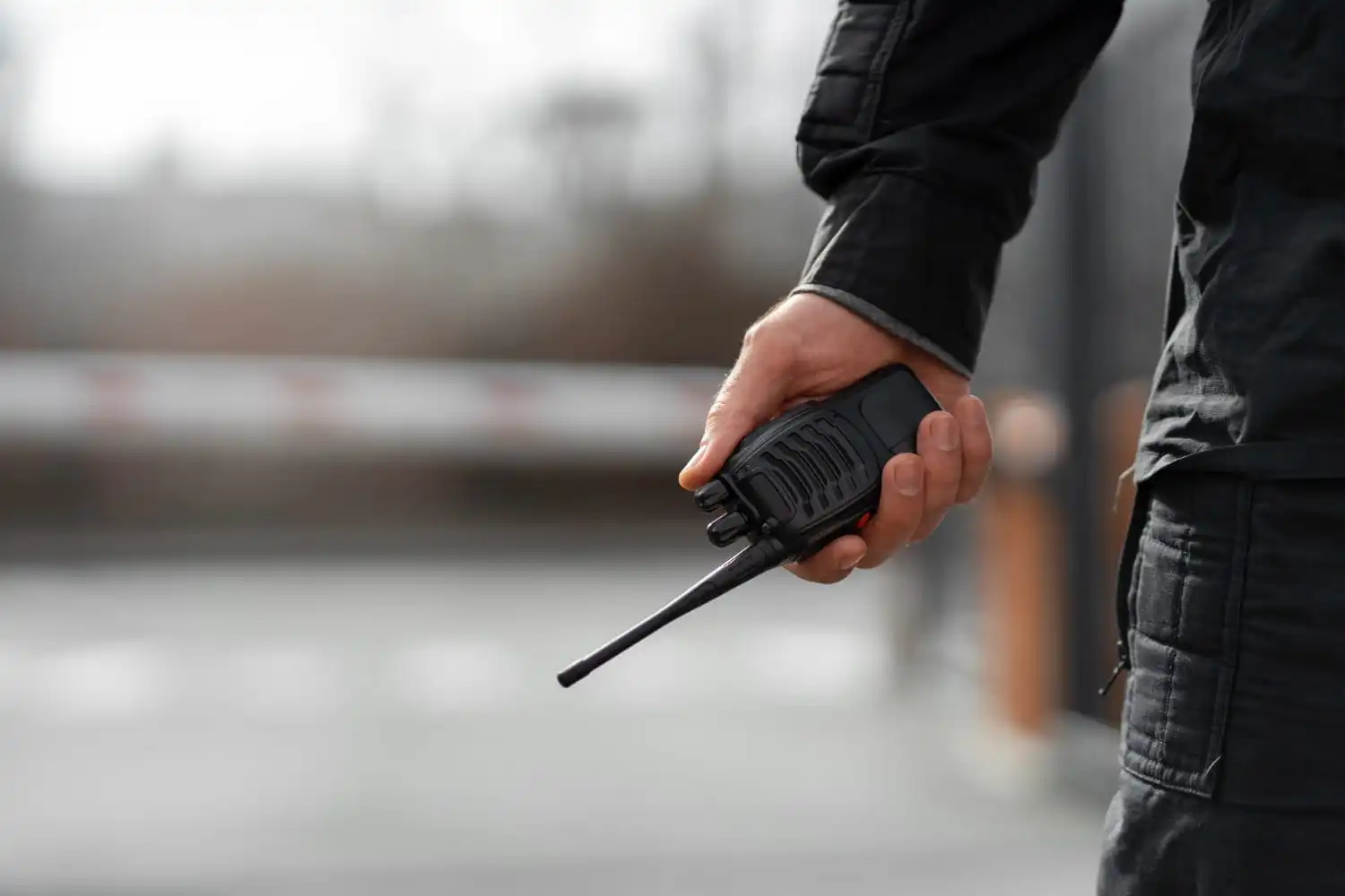 A person holding a walkie-talkie