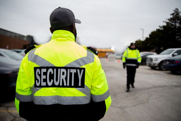 Security guards patrolling parking lot area